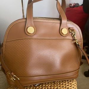 Dooney & Bourke bag with shoulder straps. It has a slight ink mark on one side.